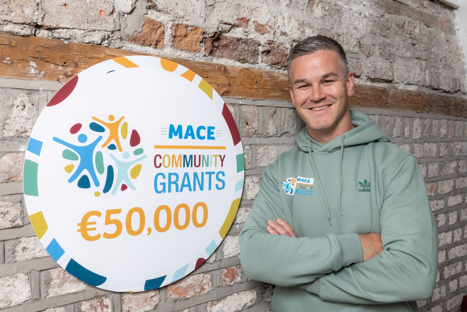 Johnny Sexton with MACE Community Grants logo