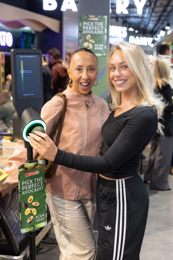 Jodie Dodrill and Zara Paolozzi try the new Avocado Scanner at SPAR KCR